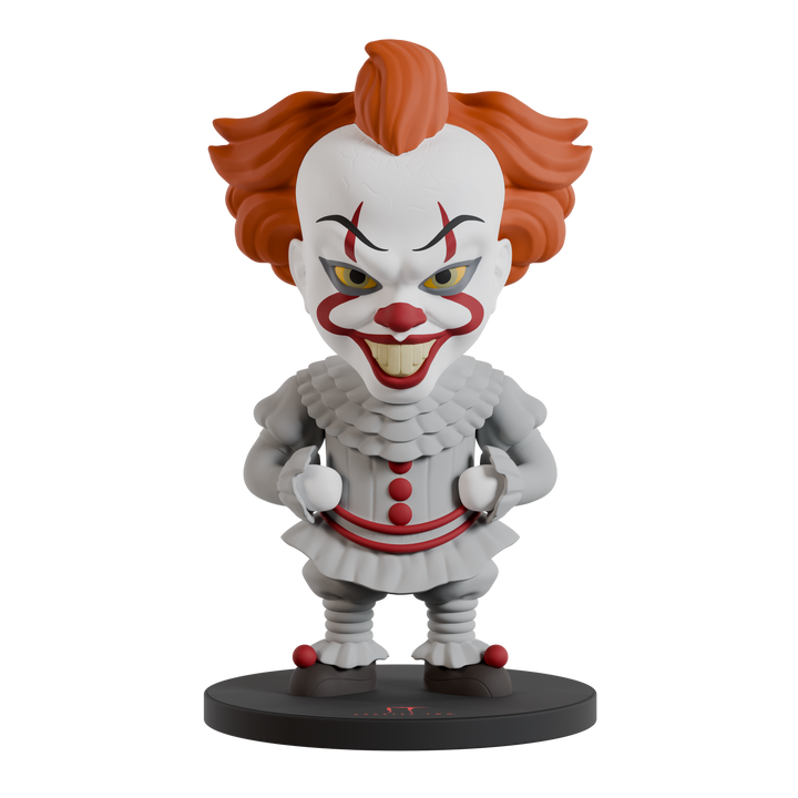 Clown figurine with red hair and white face on a black base