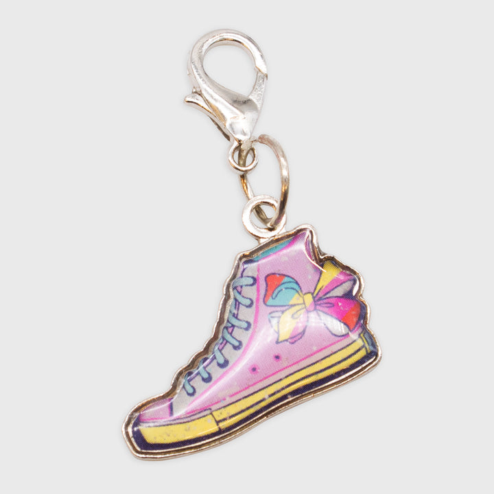 jojo siwa collectible charm. high top sneaker with bow on top of sneaker.