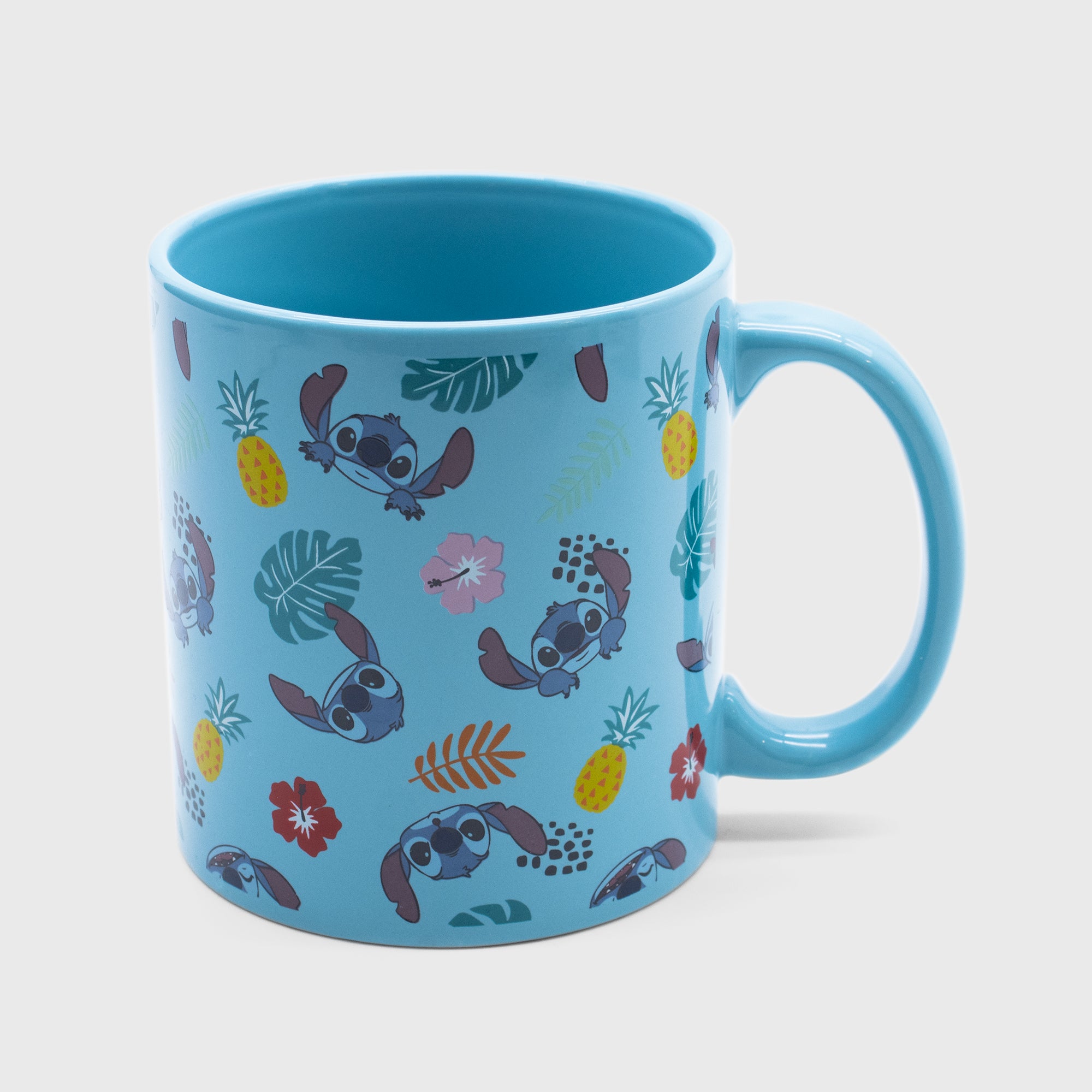 stitch mug. pattern: stitch's face, hawaiian flowers, pineapples.