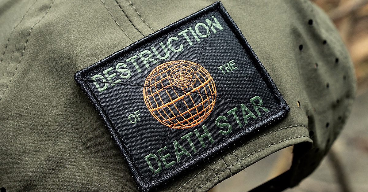 Patch with 'DESTRUCTION OF THE DEATH STAR' on a green hat