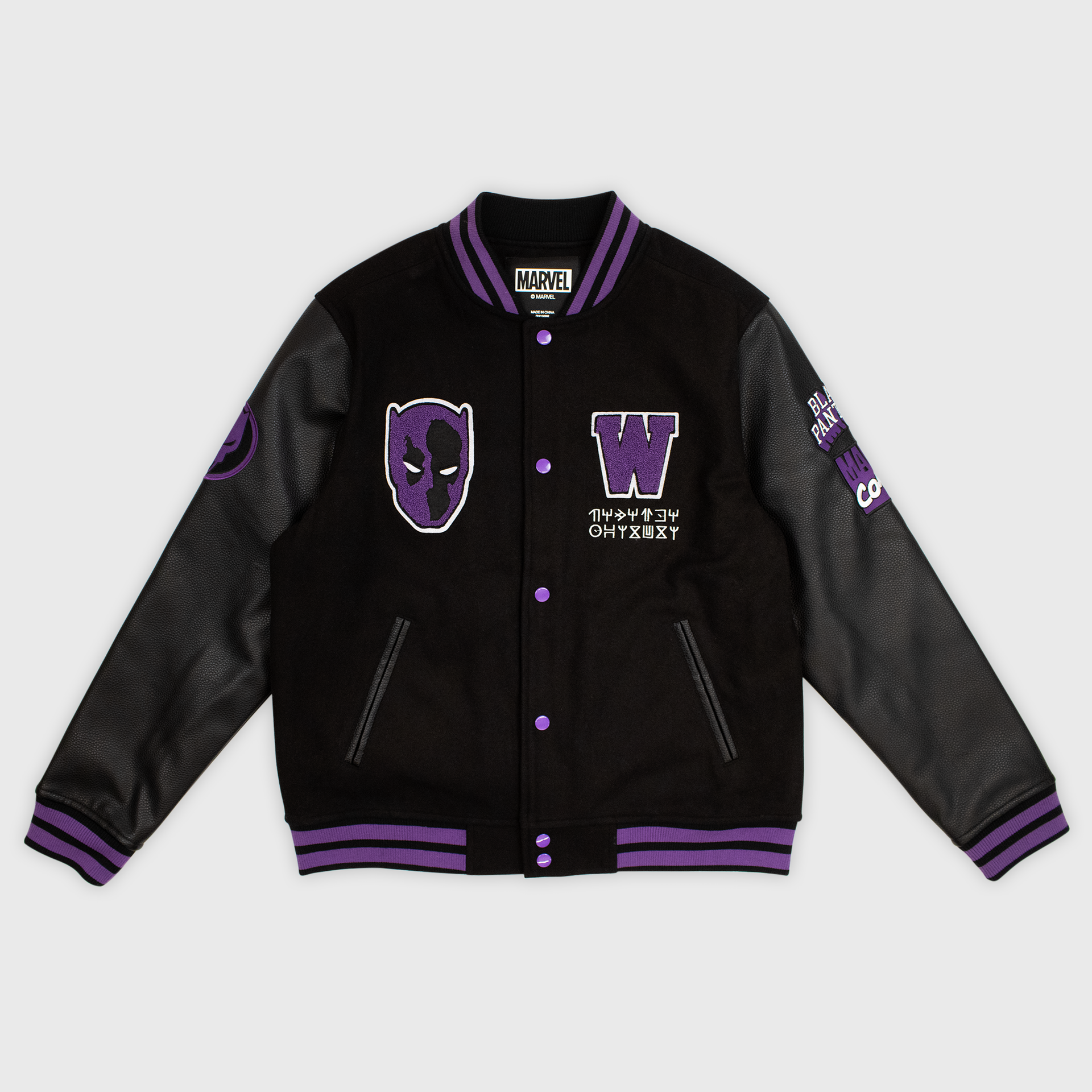 black panther letterman jacket front. image: black jacket with purple striped ends on sleeves, bottom, and collar. patch on left is purple black panther mask. patch on right is purple W with wakanda language
