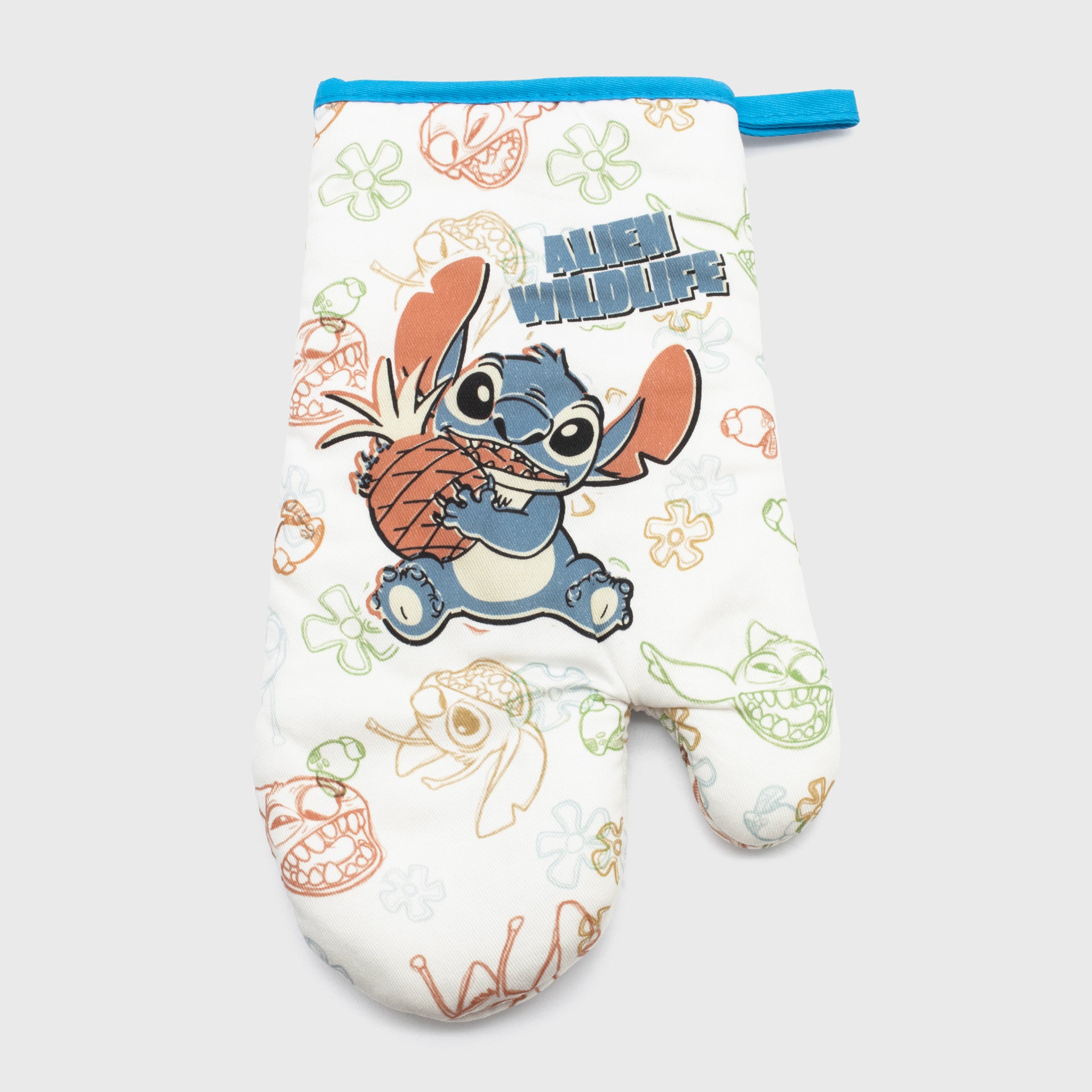 stitch holding pineapple on oven mitt. pattern of different stitch faces and flowers. text: alien wildlife