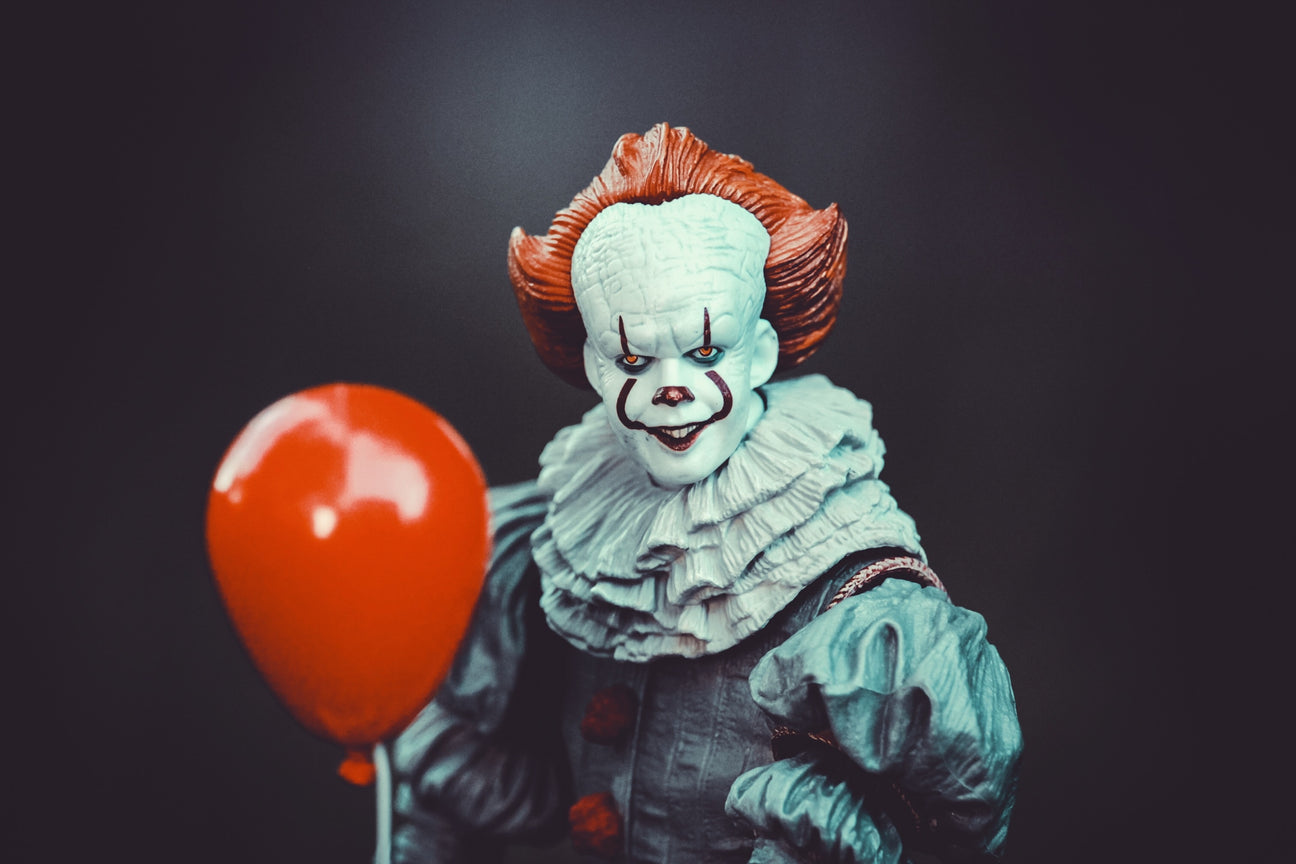 scary joker with a balloon 