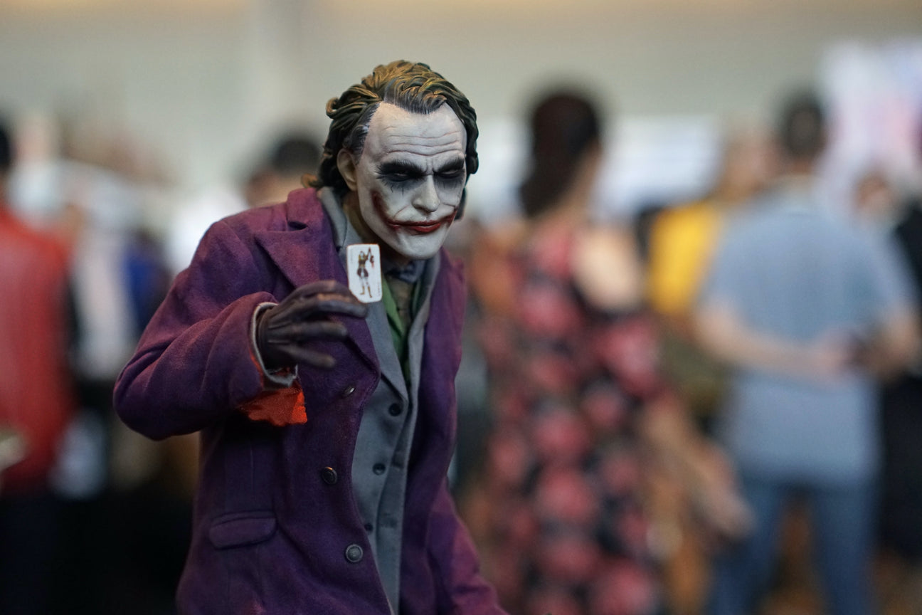 Joker holding a card