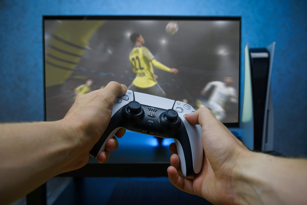 banner of a man holding game controller and playing game