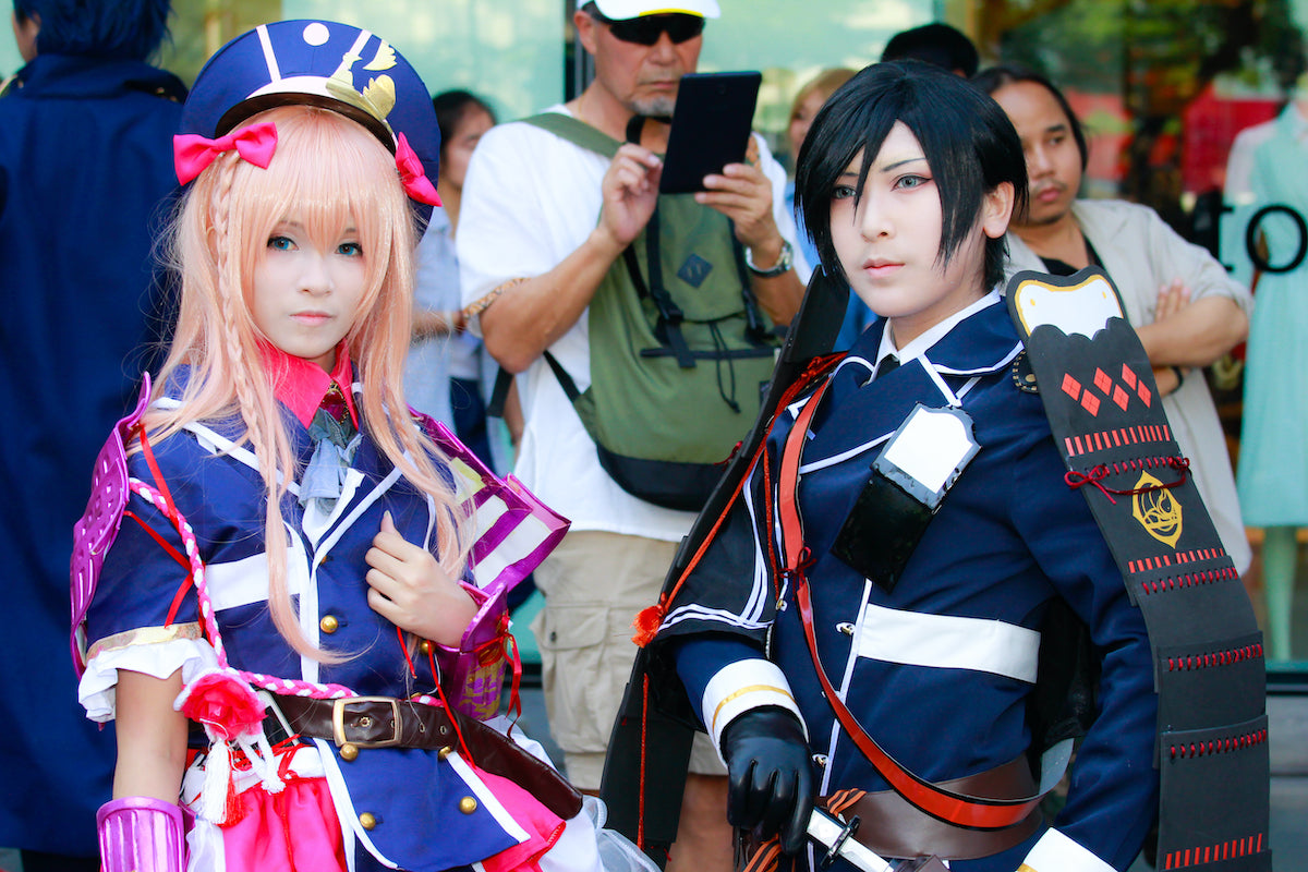 banner with male and female cosplay