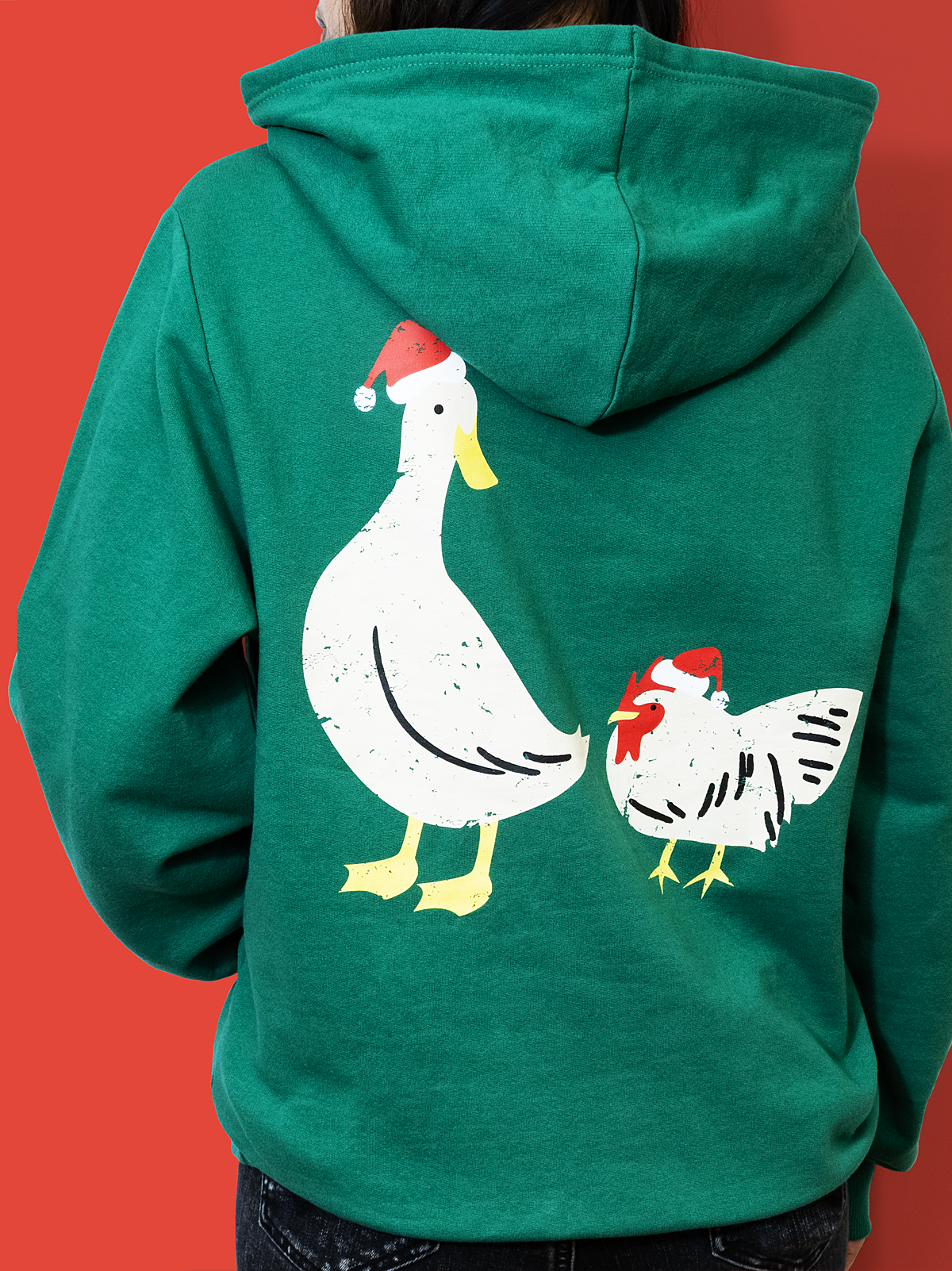 back of hoodie. duck and chicken with santa hats