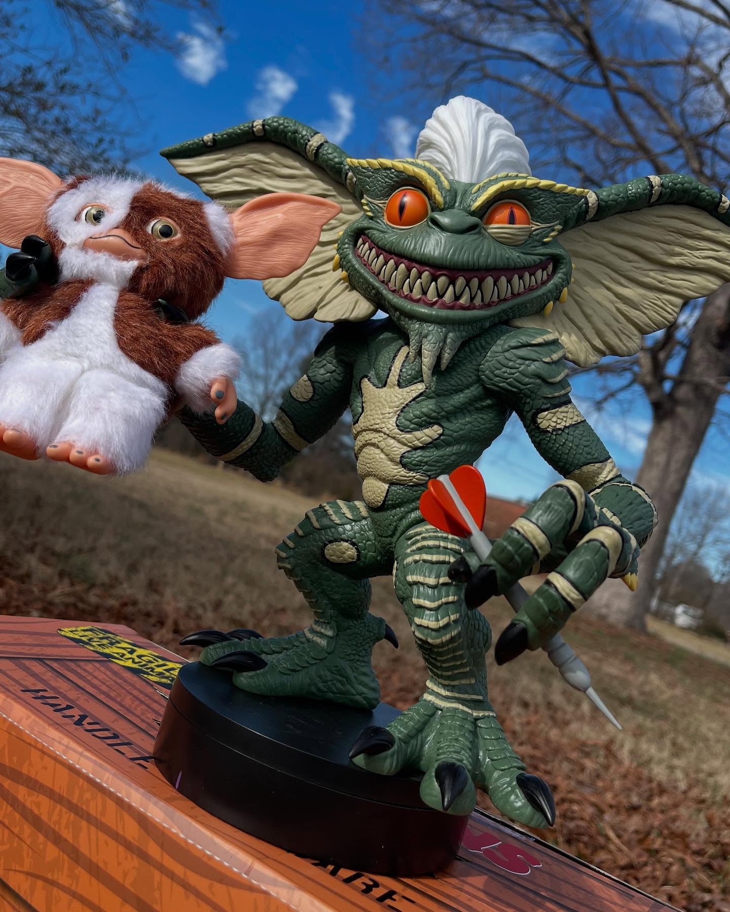 Gizmo and other characters from Gremlins in a forest setting