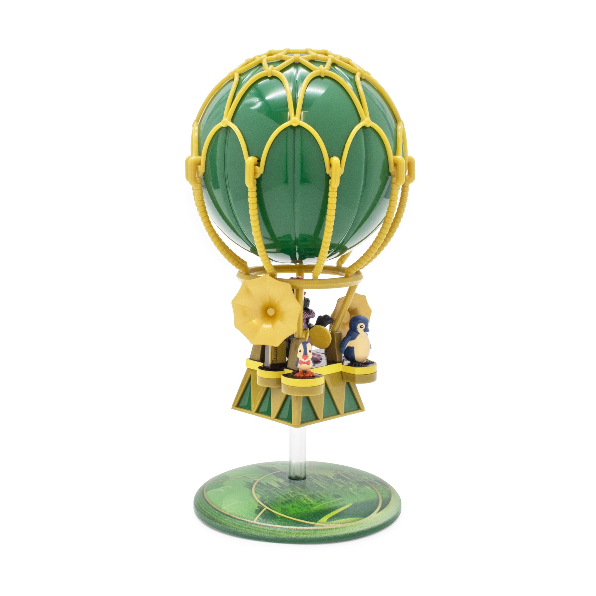 Green hot air balloon toy with characters on a white background
