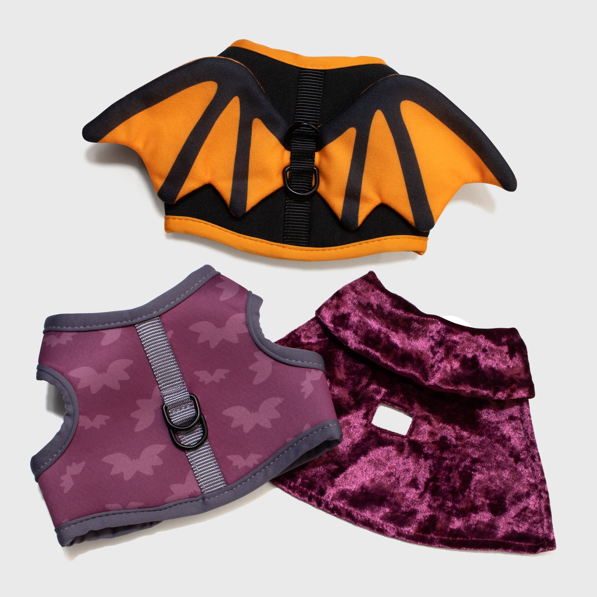 pusheen halloween cat harness set. top harness: bat wings. bottom harness: shows bottom and top of vampire cape. bottom of harness has bat pattern.
