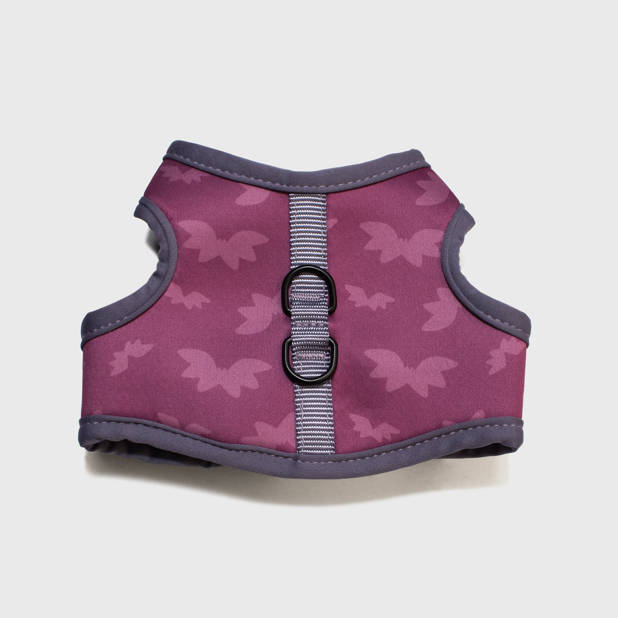 close up of bottom of vampurr vampire harness. has two rings for connecting leash. bat pattern.
