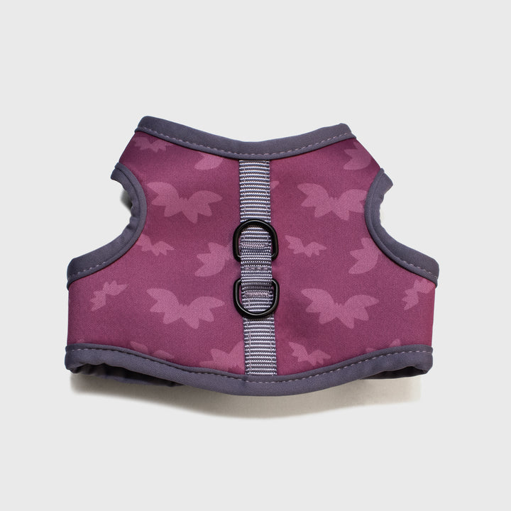 close up of bottom of vampurr vampire harness. has two rings for connecting leash. bat pattern.