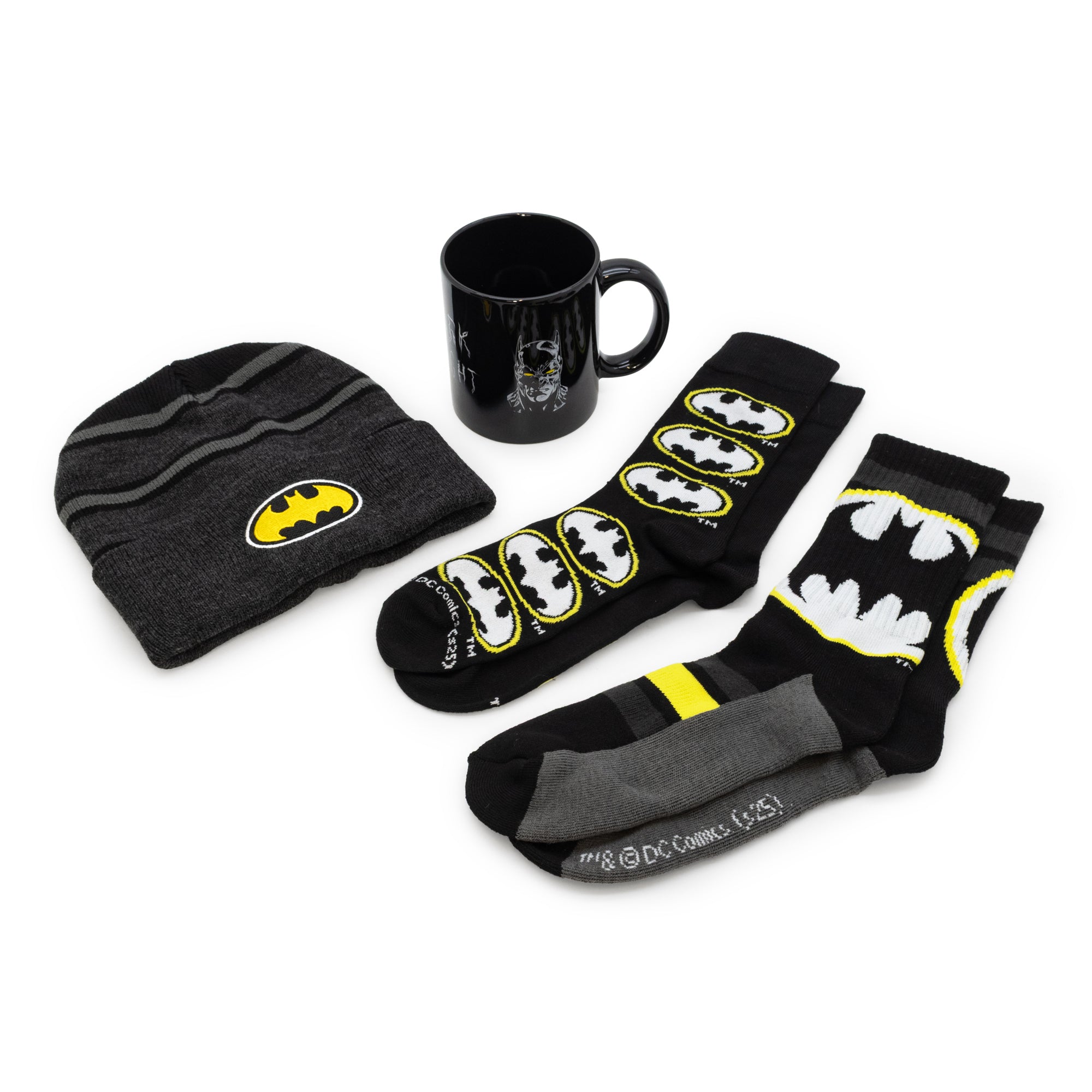Batman-themed beanie, mug, and socks on a white background