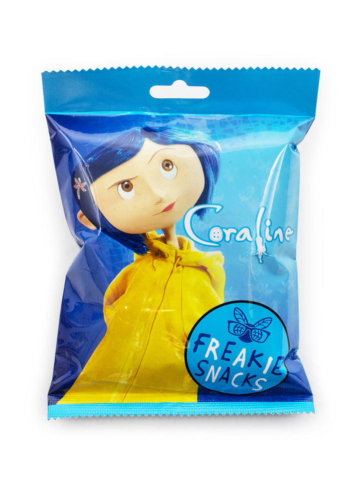 A packaged novelty snack bag featuring a printed illustration of Coraline from The Nightmare Before Christmas on a blue background, with the text 'Coraline' and 'FREAKY SNACKS' visible on the front.