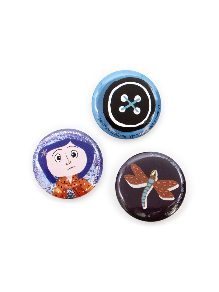 Three round pin-back buttons featuring colorful cartoon and nature illustrations, displayed on a clean white background.