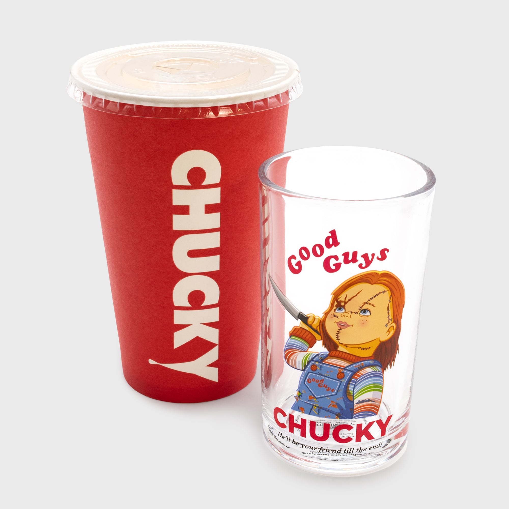 chucky freakie meal chucky glass with paper cup packaging. image on glass: chucky with knife. text on glass: good guys chucky he'll be your friend till the end! text on paper cup: chucky