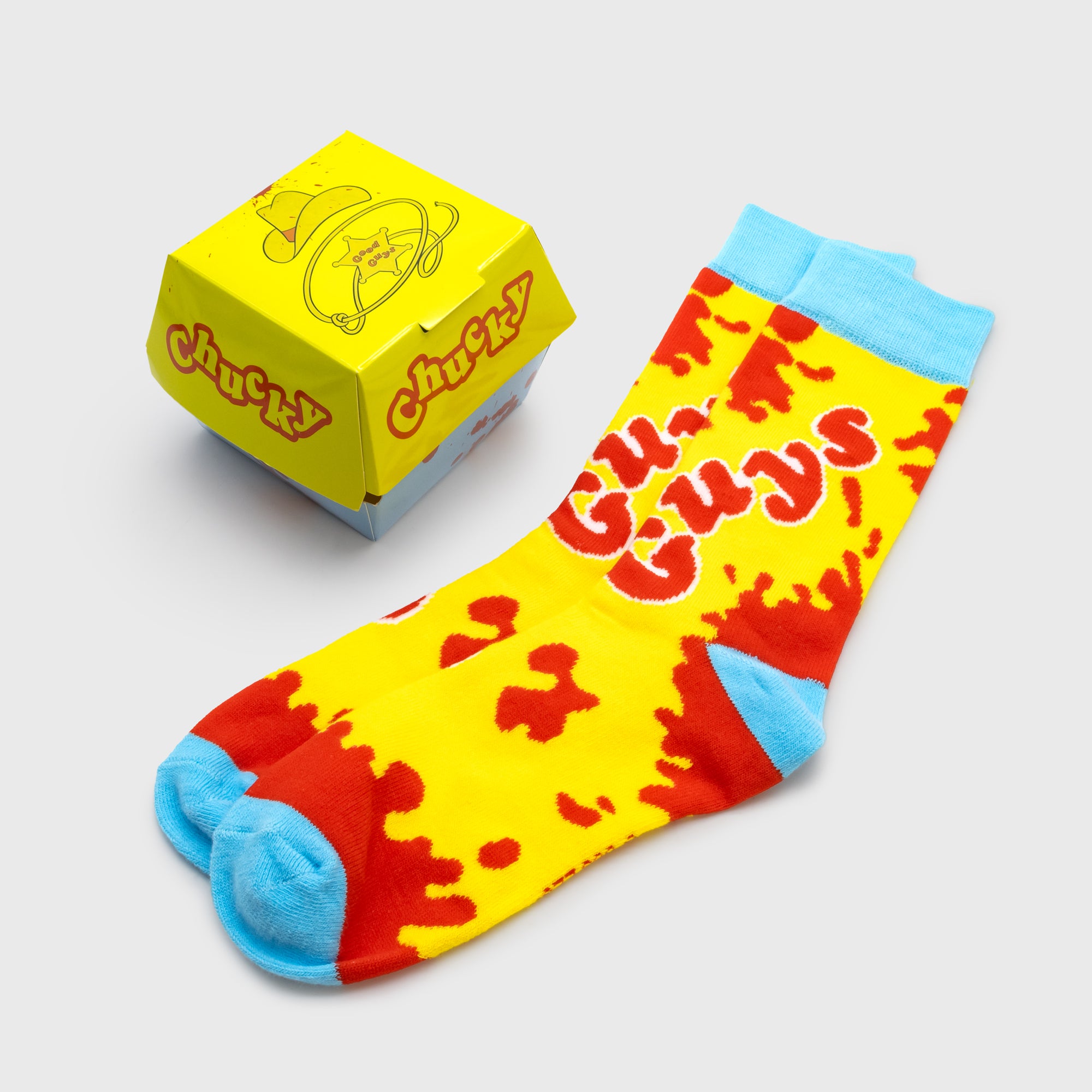 chucky freakie meal crew socks inside of burger packaging. text: good guys chucky
