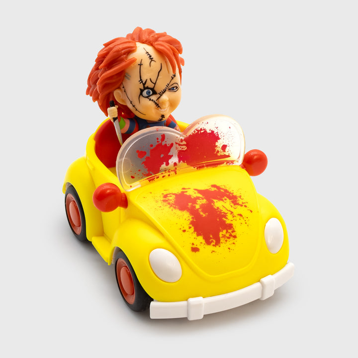 chucky freakie meal toy. smol chucky with knife riding in little car