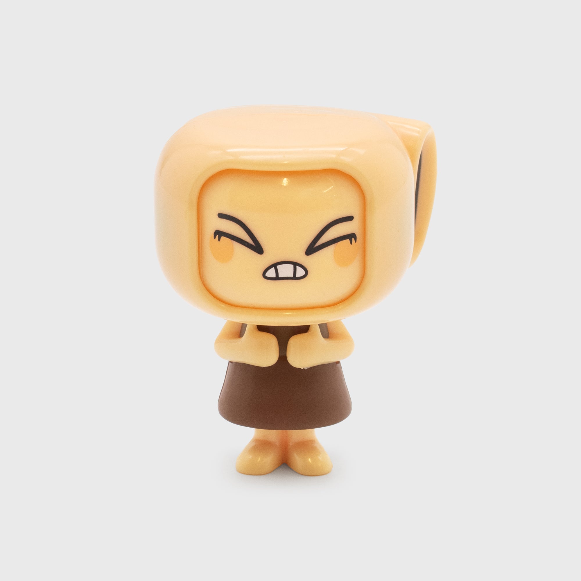 Small figurine with an angry expression on a white background