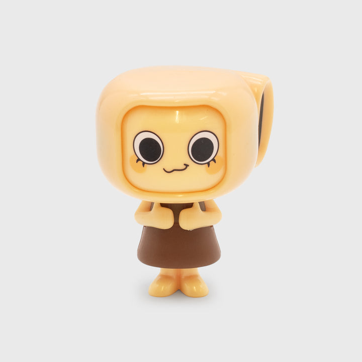 Small figurine with square head and brown outfit on a light gray background