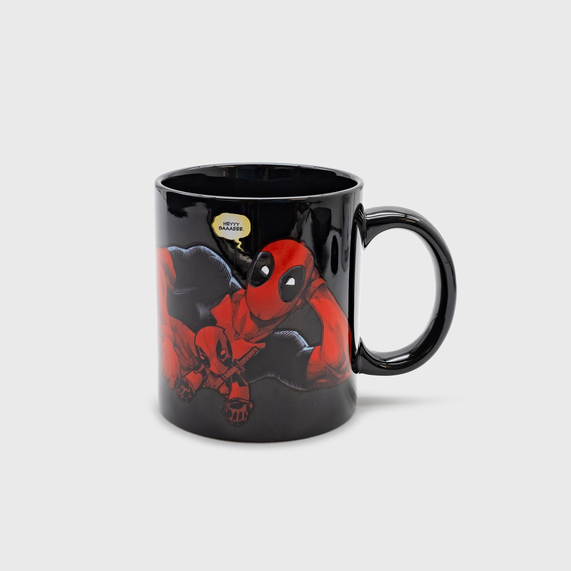 deadpool mug. image on mugL deadpool laying down with doll. speech bubble text: heyyy baaaeee.