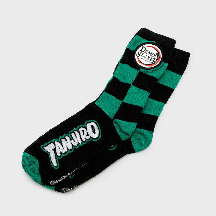 crew socks. text on bottom: tanjiro. checkered pattern on top. demon slayer logo patch. text: demon slayer kimetsu no yaiba.