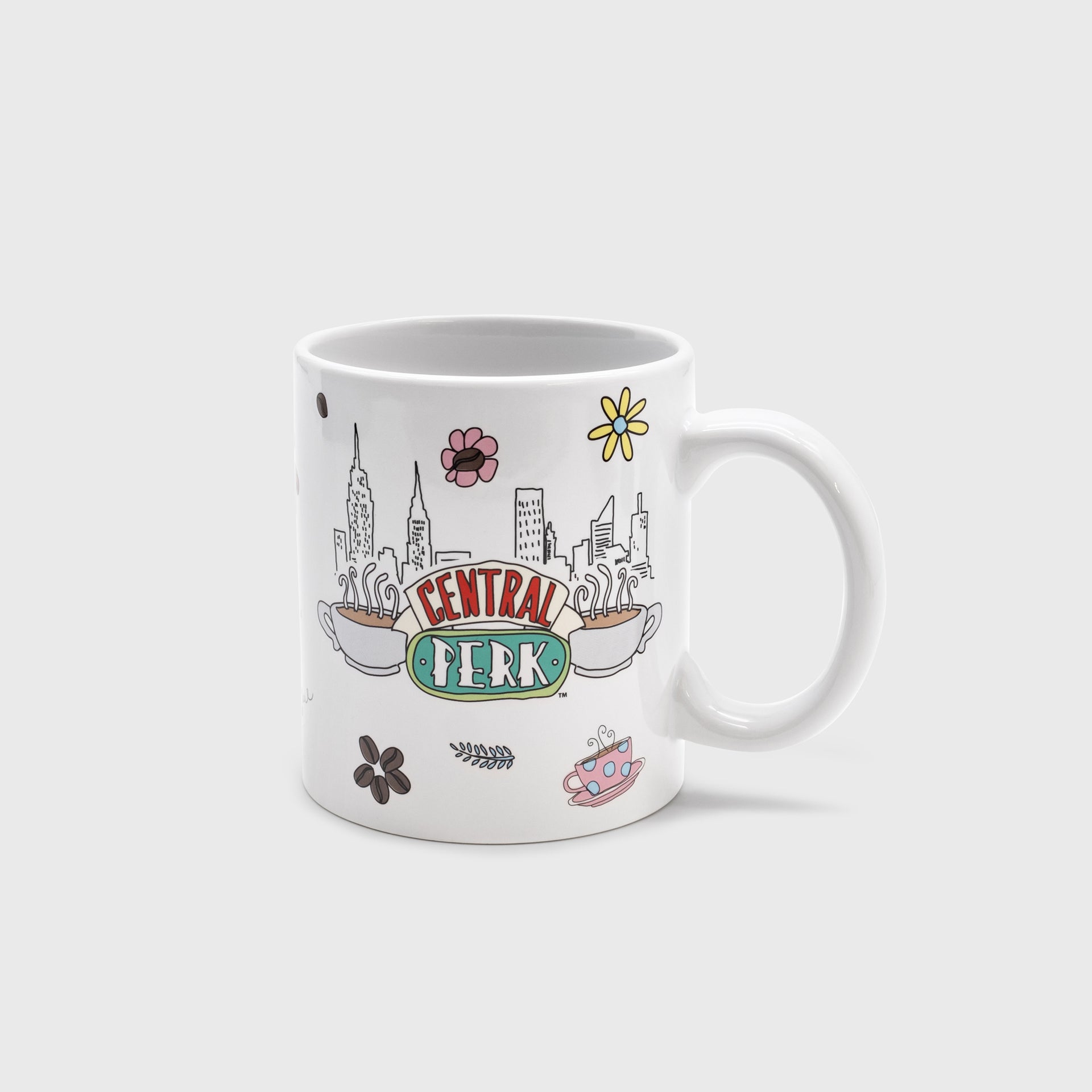 side 1 of mug. image: central perk logo. coffee cup. flower. coffee beans. nyc skyline.