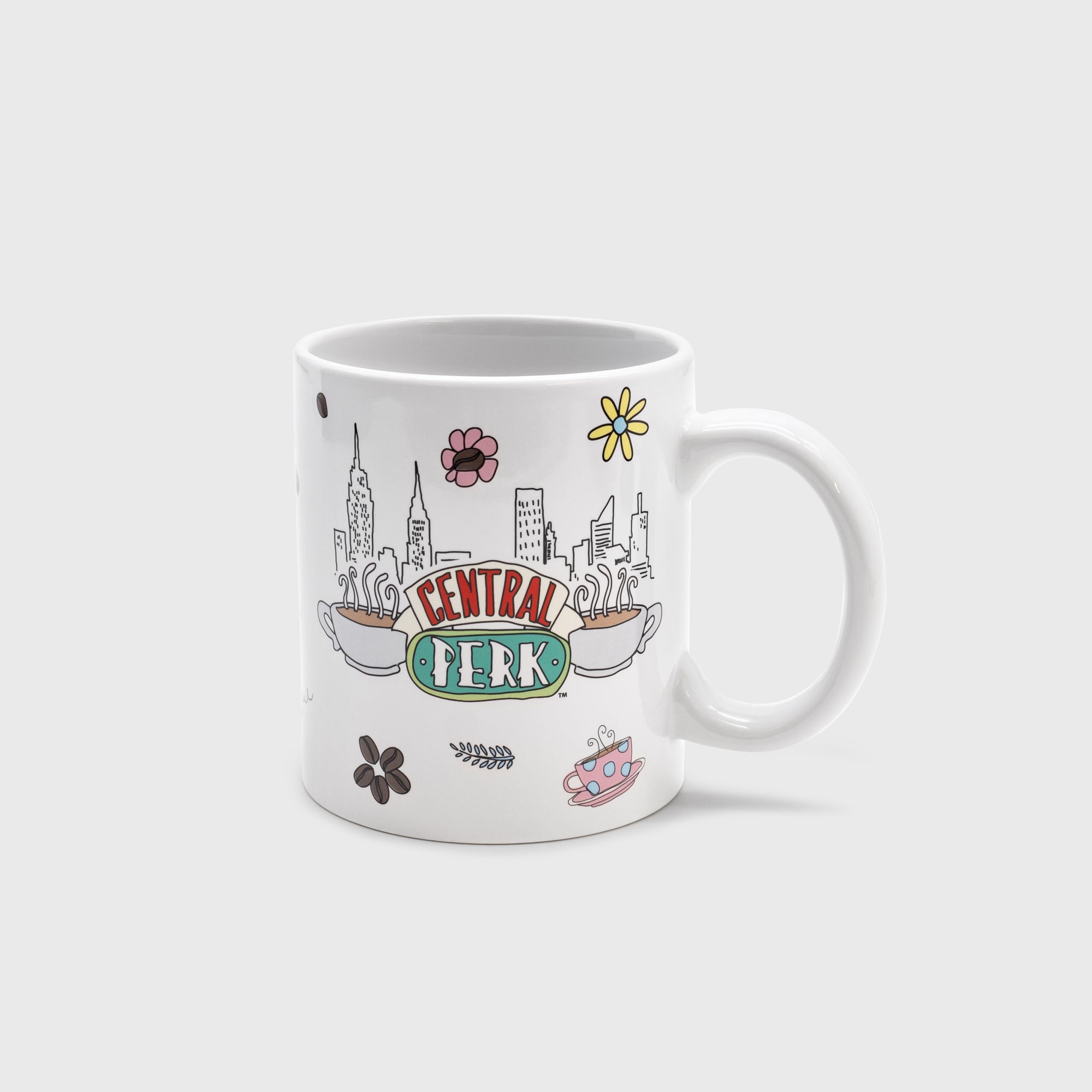 side 1 of mug. image: central perk logo. coffee cup. flower. coffee beans. nyc skyline.