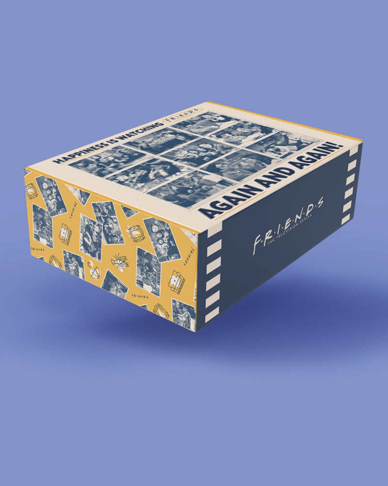 A 3D-rendered product box for the movie 'Again and Again' floating against a solid periwinkle blue background. The box features a navy blue top panel with white text, a side panel with a yellow and white collage pattern, and a front panel with a white script logo reading 'FRIENDS'.