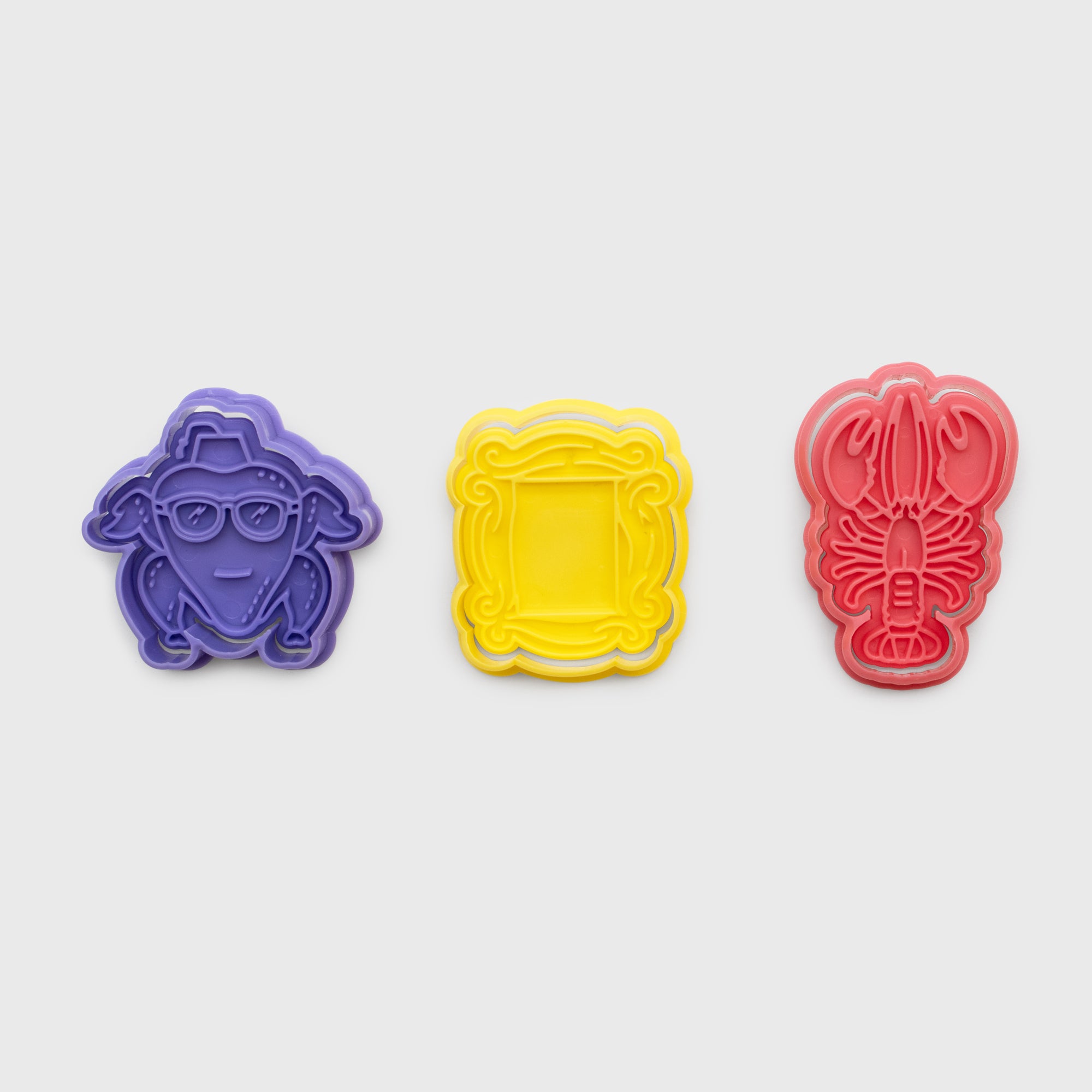 3 cookie cutters. turkey head, picture frame, lobster