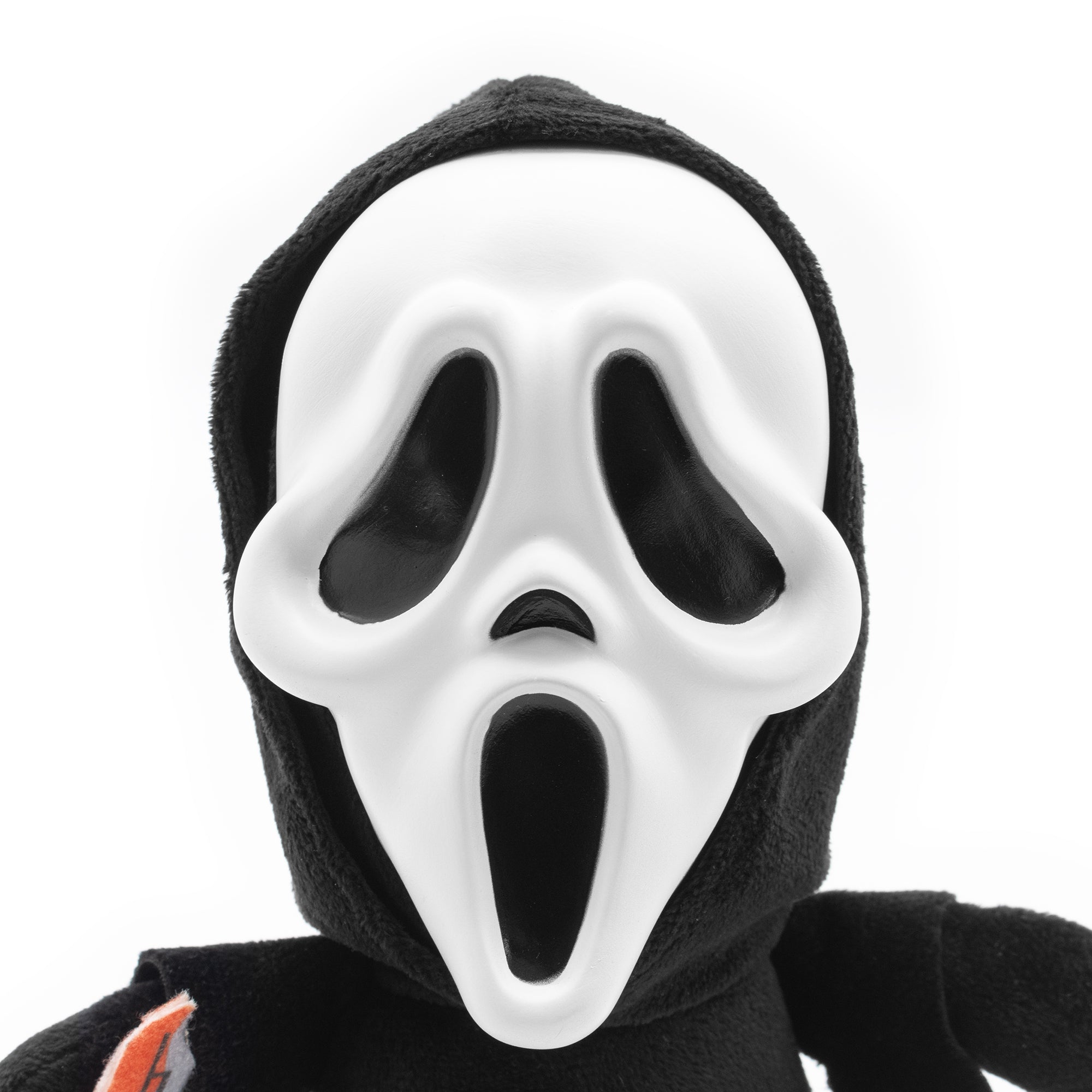 Plush toy with a white mask resembling a famous horror character on a white background
