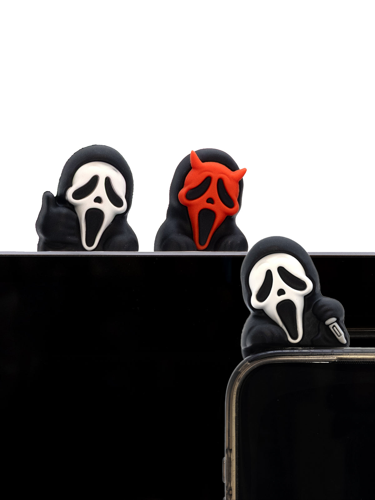 Three phone cases with ghost face designs on a black background