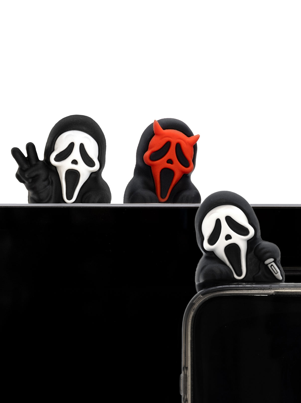 Three phone cases with different masks huggers on a white background