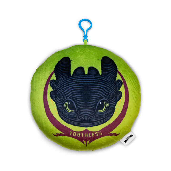 Plush toy with Toothless from 'How to Train Your Dragon' on a green background