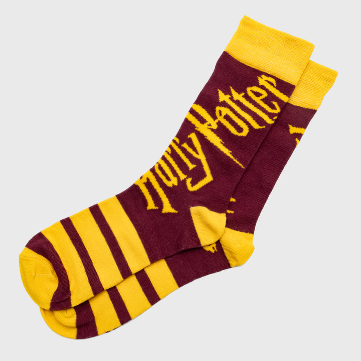 crew socks. text on top: harry potter. 3 stripes on bottom.