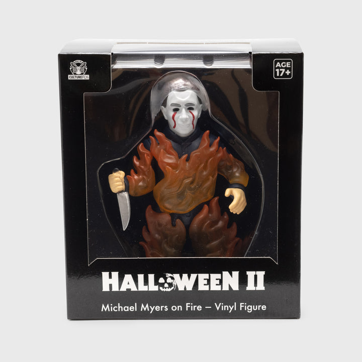 halloween II michael myers figure in packaging. text: halloween II michael myers on fire - vinyl figure age 17+ culturefly