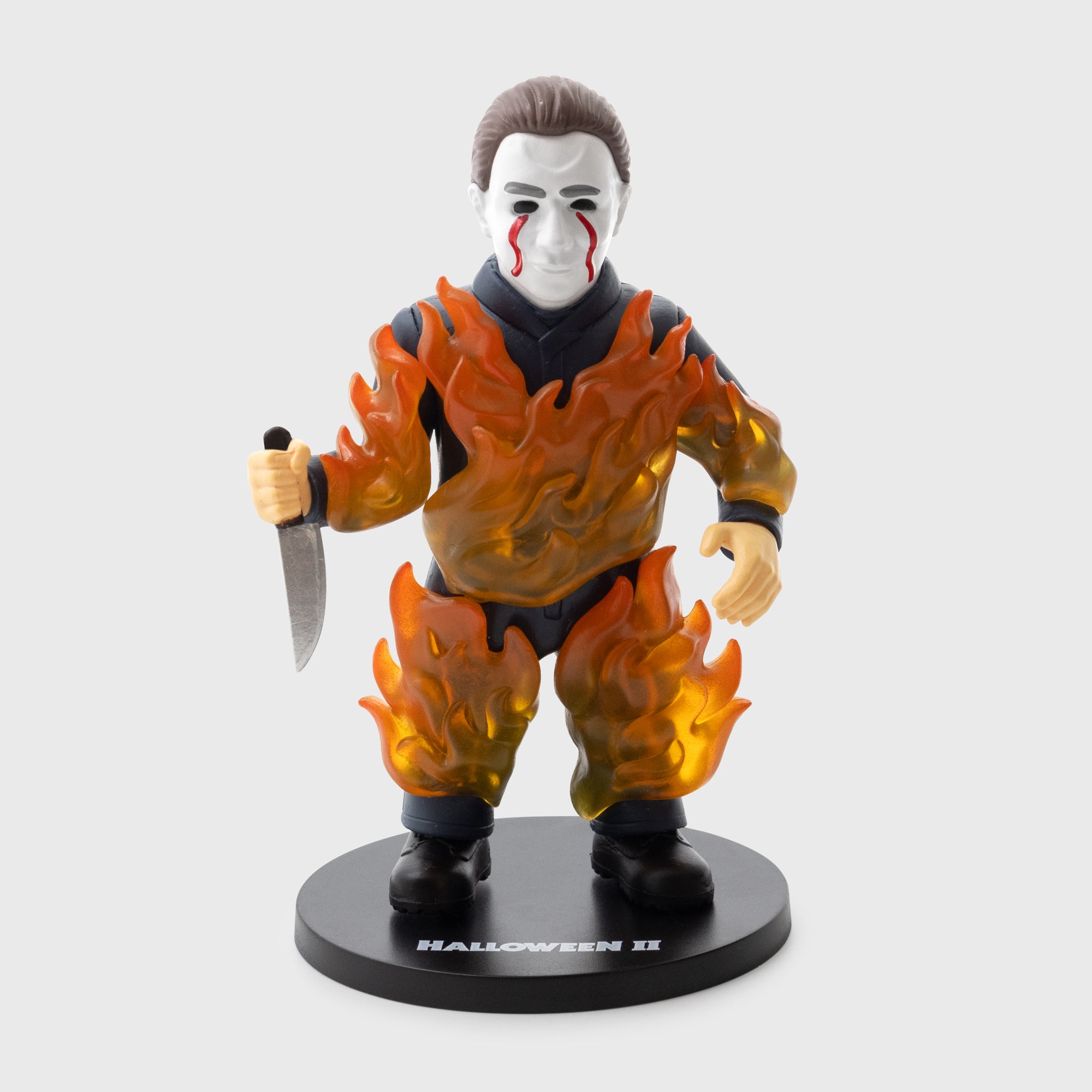 halloween II michael myers vinyl figure michael on fire holding knife blood dripping down face. text on stand: halloween II