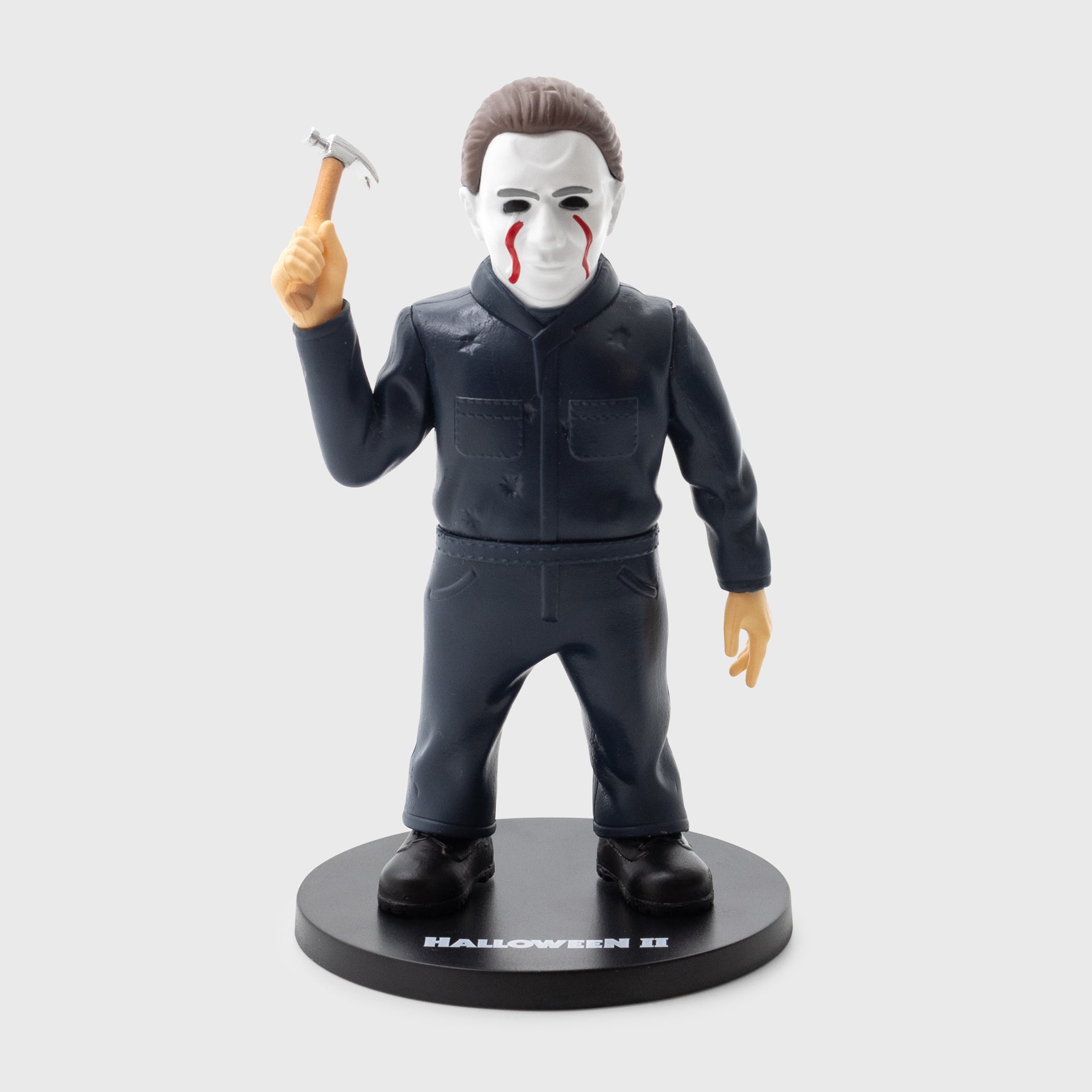 michael myers figure holding hammer with blood dripping down face. text on stand: halloween II