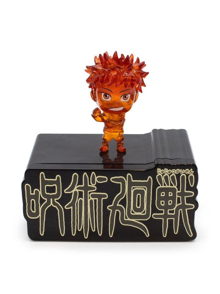 Orange figurine of yuji on a black base with white text on a white background