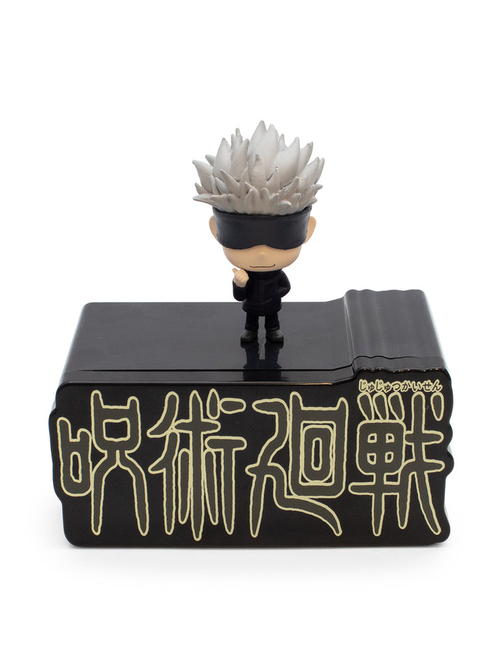 Figurine of gojo on a black base with gold text on a white background