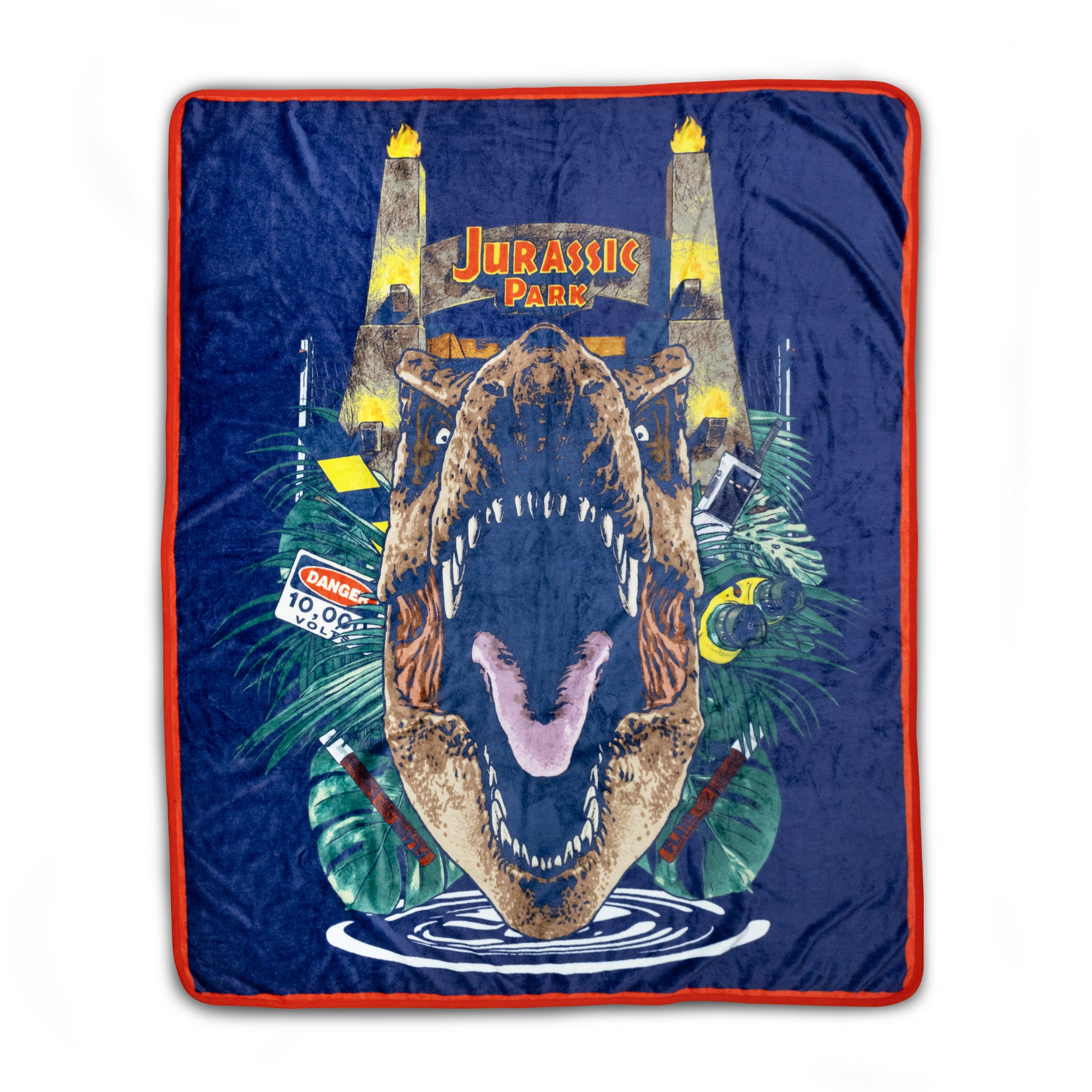 Blanket with a dinosaur design and 'Jurassic Park' text on a blue background