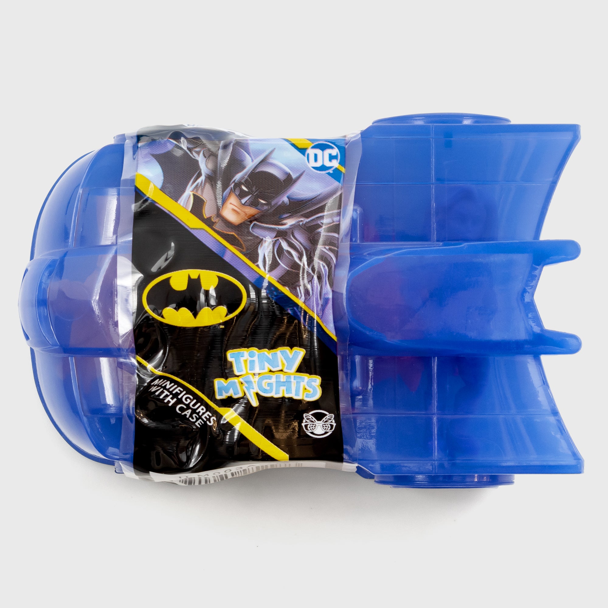tiny nights packaging. the bat mobile. text: tiny mights minifigures with case. image on packaging: batman reaching out. bat symbol logo. dc comics logo, culturefly logo.