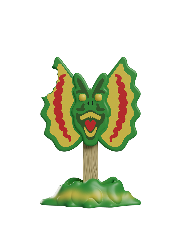 Toy figure of a green and yellow creature with red accents on a white background