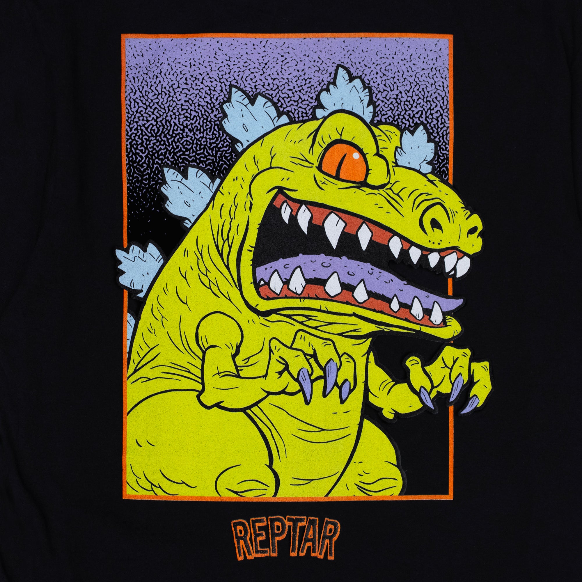 james groman reptar black tee close up of back of shirt. image: reptar dinosaur with claws ready. inside rectangle. text: reptar