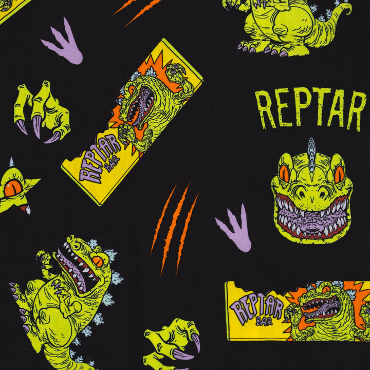 james groman reptar woven shirt detail. image: reptar dinosaur full body, reptar dinosaur reptar bar with bite, reptar dinosaur hand with claws, reptar dinosaur eye in star, claw slash, dinosaur footpring, reprar dinosaur head facing forward. text: reptar.