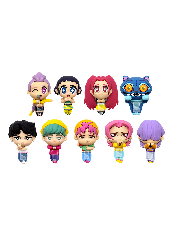 A set of eight small cartoon-style character figures arranged in two rows on a plain white background. The characters have colorful hair and outfits in shades of pink, purple, blue, yellow, green, and black.
