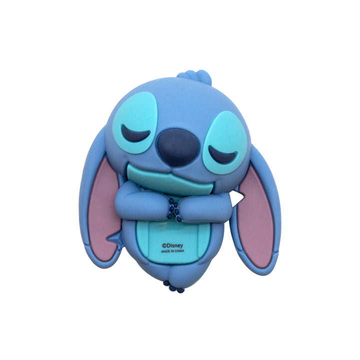 A blue and light blue character-shaped product featuring a sleeping face, pink inner ears, and a small Disney logo on the front, shown against a plain white background.