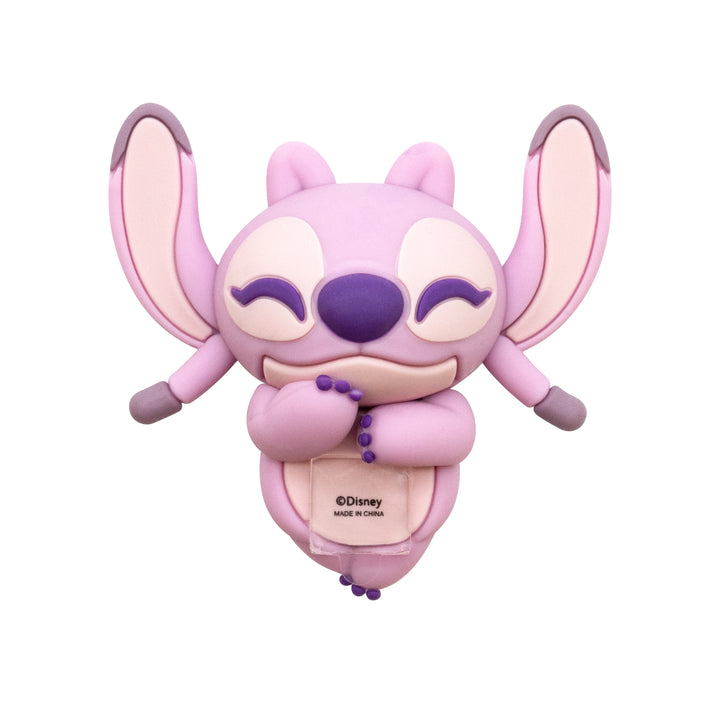 A pink and purple Angel Stitch character accessory, possibly a phone case, featuring a cute cartoon design with closed eyes, on a plain white background.