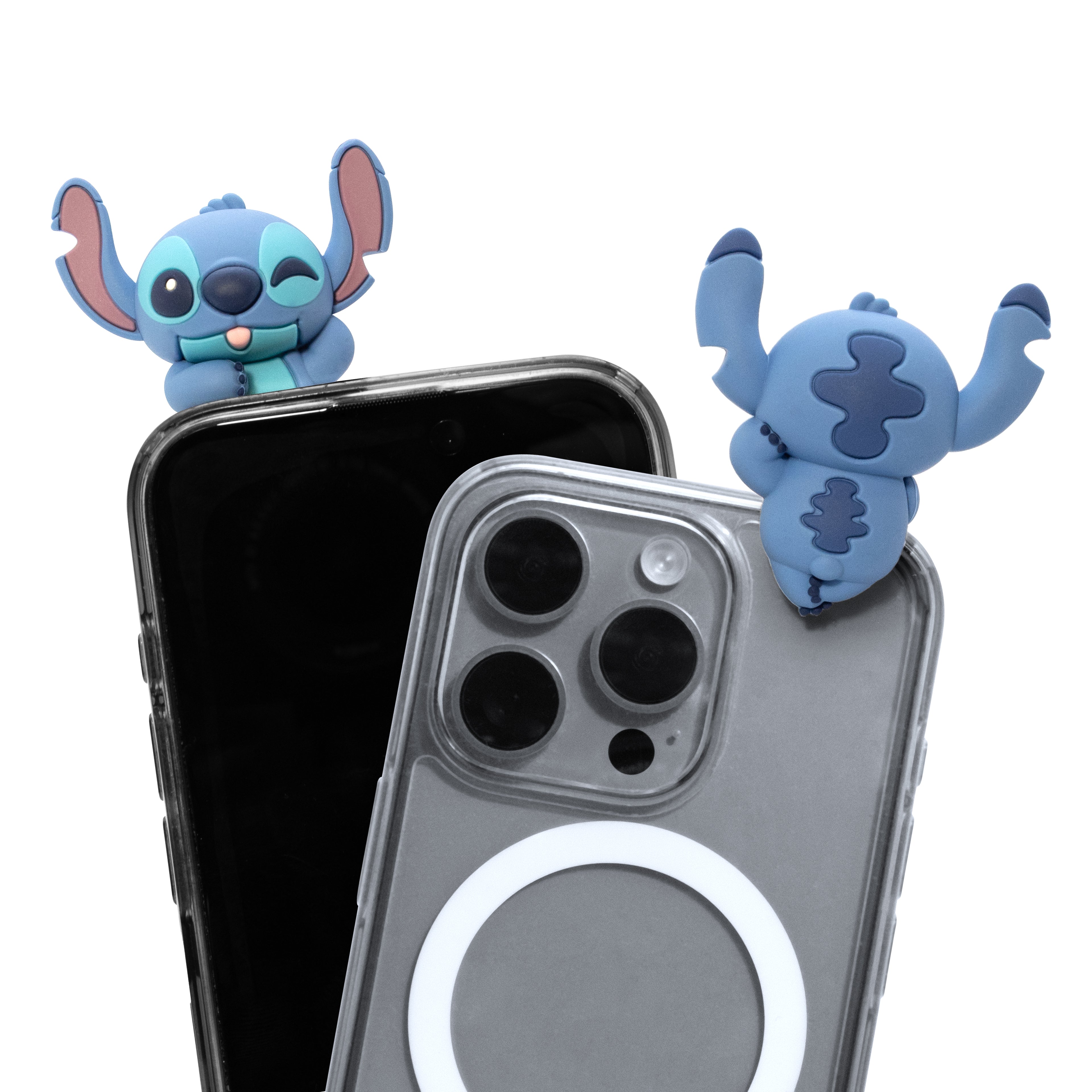 Two blue cartoon character phone accessories with large ears are shown attached to the top of two smartphones, one black and one gray, on a plain white background.