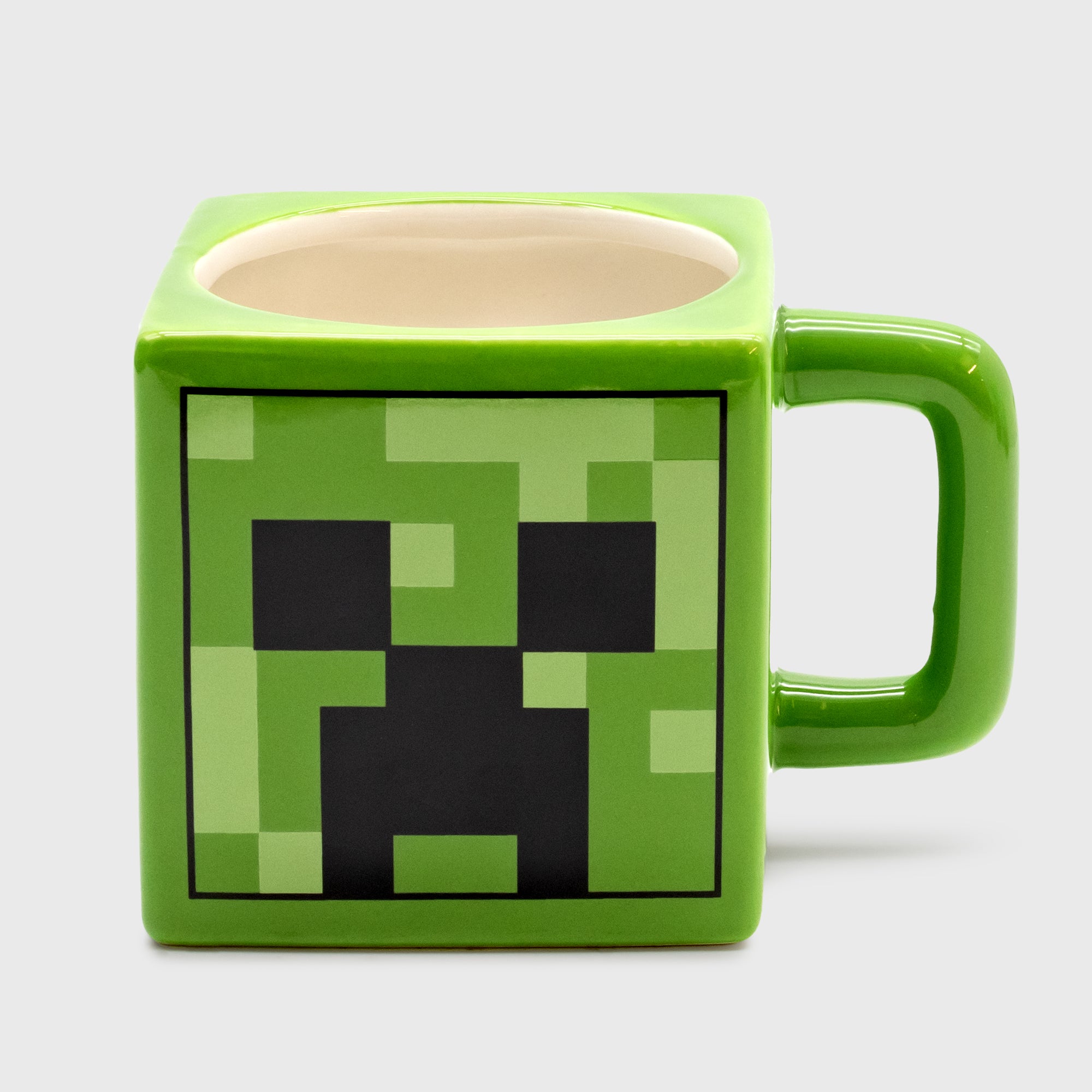 square mug with handle. creeper face on side.
